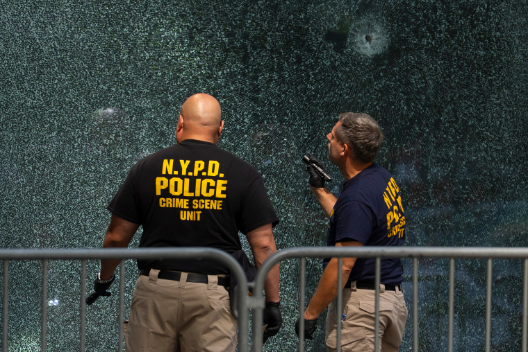Investigators look at bullet holes