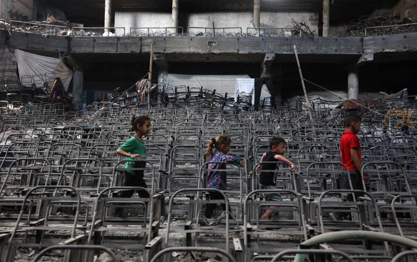 Gazan children playing in the rubble of the Islamic Univerity