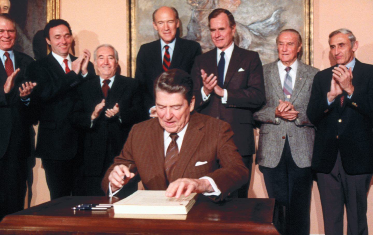Ronald Reagan signing the 1986 Immigration Reform and Control Act.