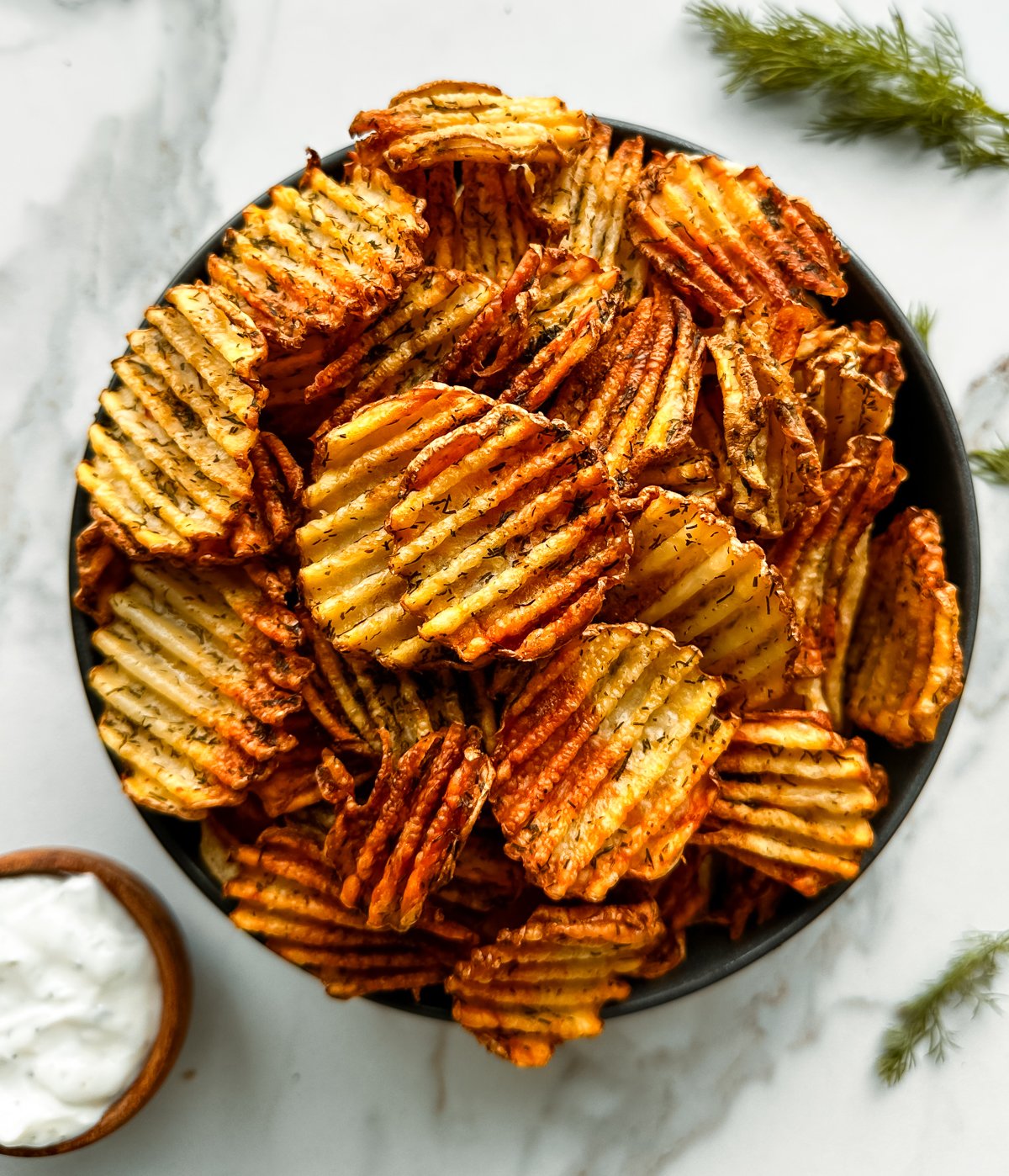 a bowl of crinkle potato chips made in the air fryer