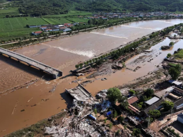 a drone view shows damaged roads and fallen trees next to the overflowing qingshui river after heavy rainfall flooded the area in miyun district of beijing china july 29 2025 photo reuters a drone view shows damaged roads and fallen trees next to the overflowing qingshui river after heavy rainfall flooded the area in miyun district of beijing china july 29 2025 photo reuters