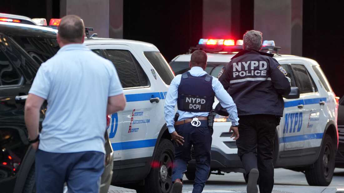 New York Police Department officers are seen as they respond to an incident in the Midtown Manhattan neighborhood of New York on July 28, 2025.