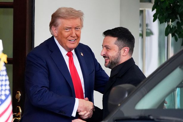 A photo of Trump and Zelensky shaking hands