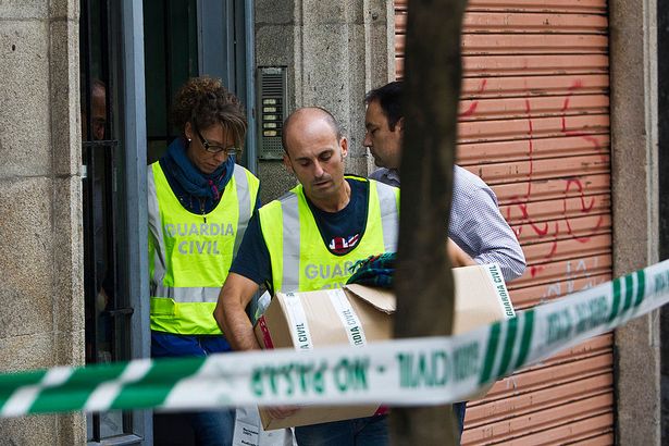 Spanish detectives search the homes a lawyer and her ex-husband as they probed the suspected killing of their adopted Chinese-born, 12-year-old daughter.