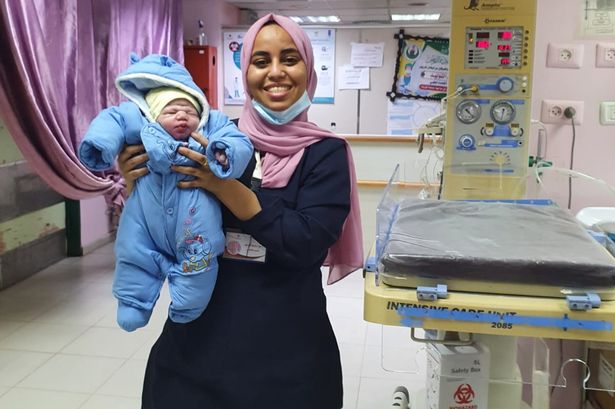 Soha at work with a baby