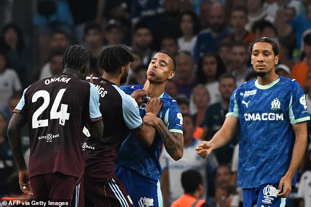 Marseille forward Mason Greenwood (centre) has been accused of spitting at Amadou Onana