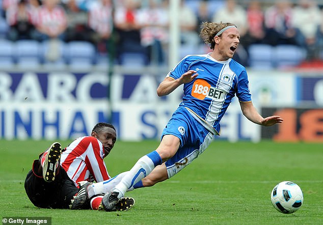 Ronnie Stam (right), pictured playing for Wigan in 2010, has been convicted of drug smuggling
