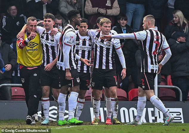Grimsby Town (pictured last term) host Manchester United in the Carabao Cup second round
