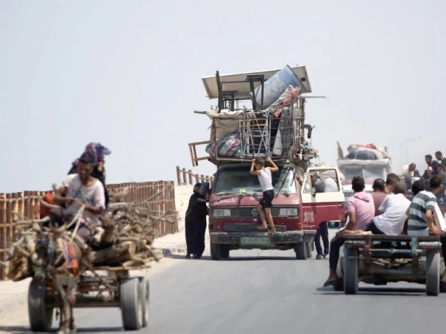 palestinian families arrive with their belongings in the nuseirat in the central gaza strip as they flee their homes in gaza city heading toward the south photo afp