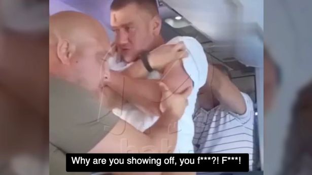 The man was held back by fellow passengers