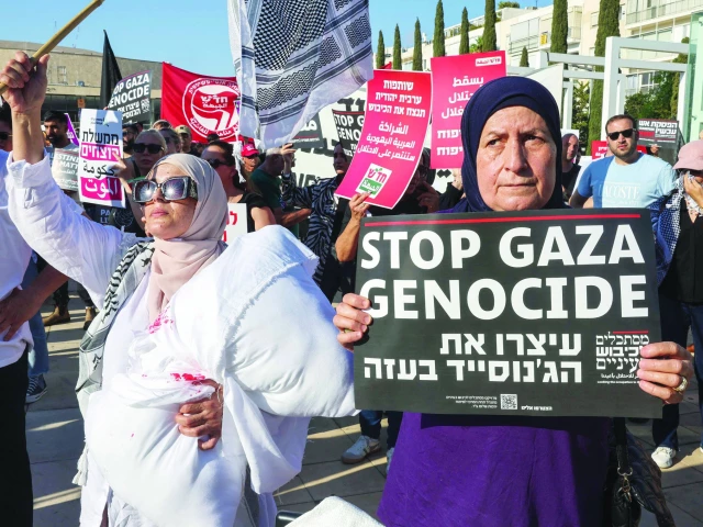 arab israeli and israeli left wing activists hold placards and photos of malnurished children during a protest at habima square in tel aviv against the ongoing war and the catastrophic humanitarian situation in the gaza strip photo afp
