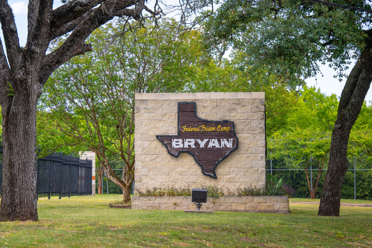 Signage is displayed near the entrance to Federal Prison Camp Bryan