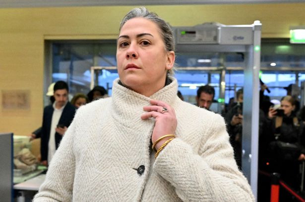 Caroline Darian passes through security check as she arrives at the courthouse in Avignon