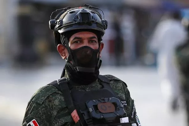 Anti-Narco Special Forces man stands guard in Tahrir Square, Baghdad