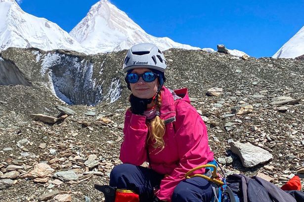 The son of stranded Russian climber Natalya Nagovitsyna, 47, has urged rescuers to resume their search