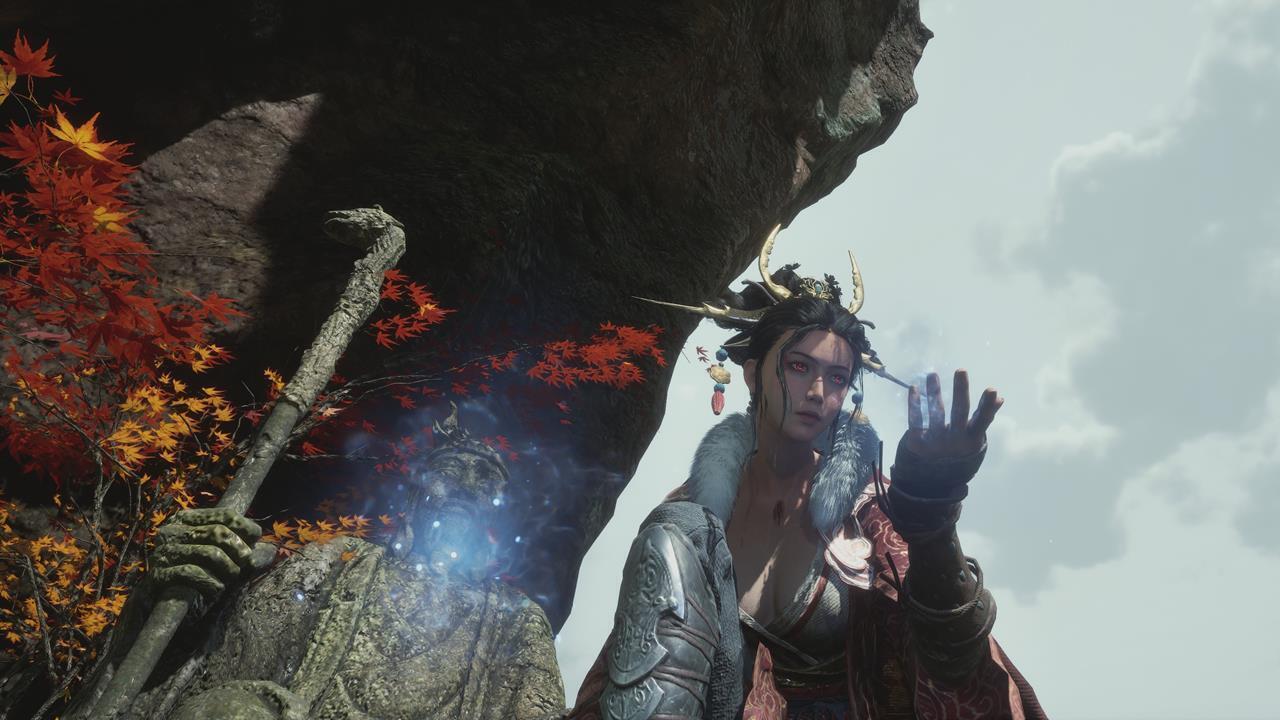 Wuchang kneels as magic pulses in her hand.