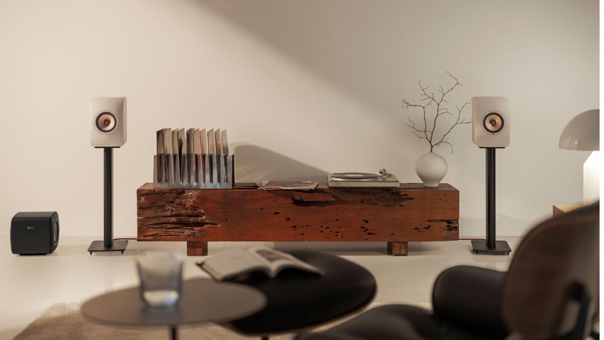 KEF LS50 Wireless II speakers in Sand Shell in a neutrally decorated room