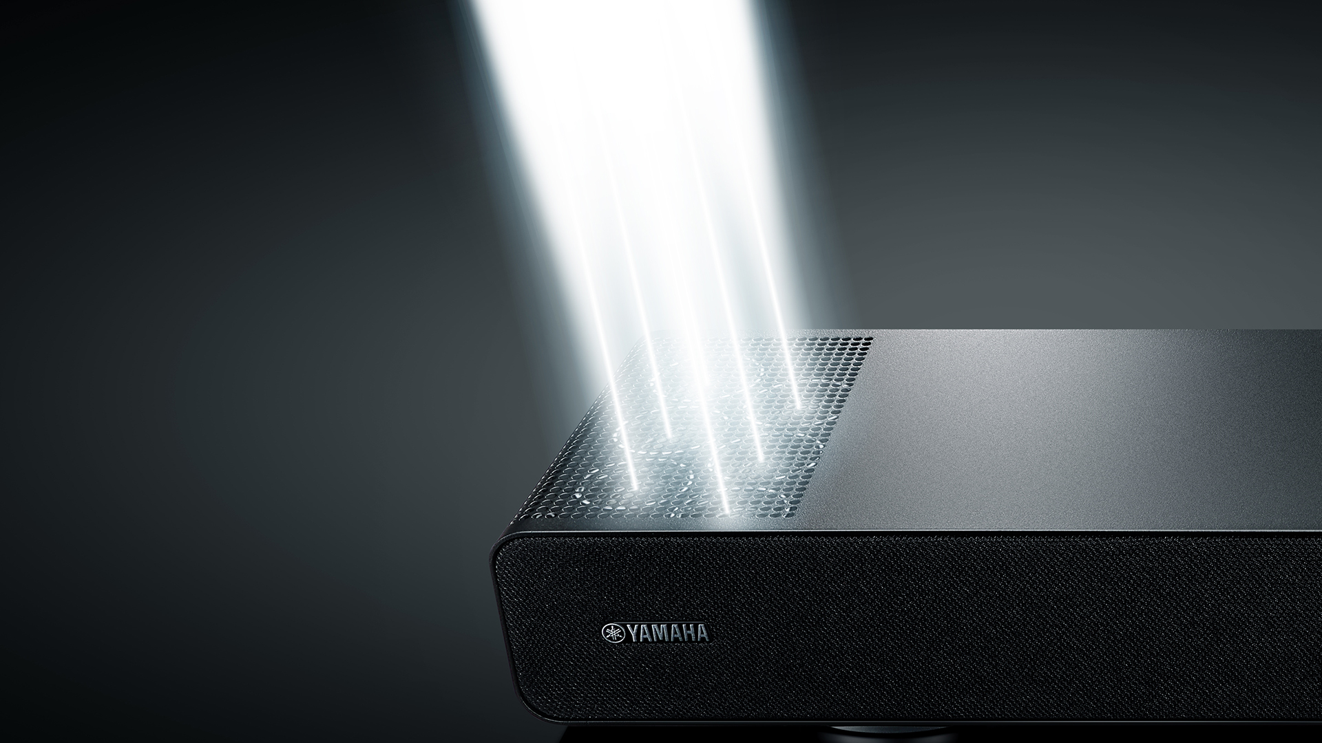 Yamaha True X Surround 90A top speakers, beaming light out as a representation of the sound being fired out