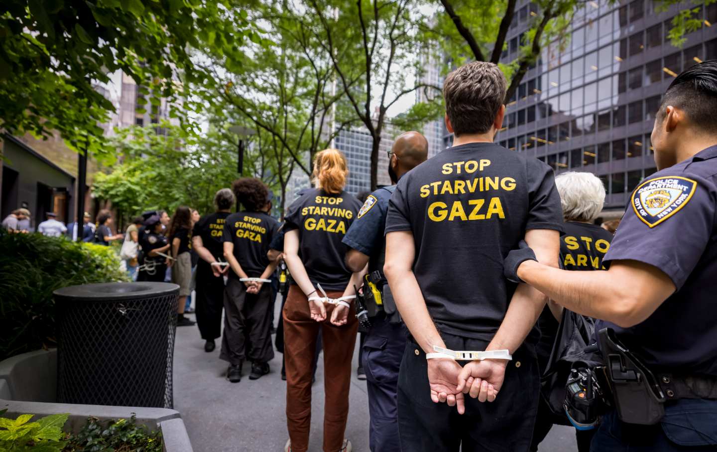 Members of Jewish Voice for Peace are led away after being arrested for occupying the New York offices of Sens. Chuck Schumer and Kirsten Gillibrand on August 1, 2025.