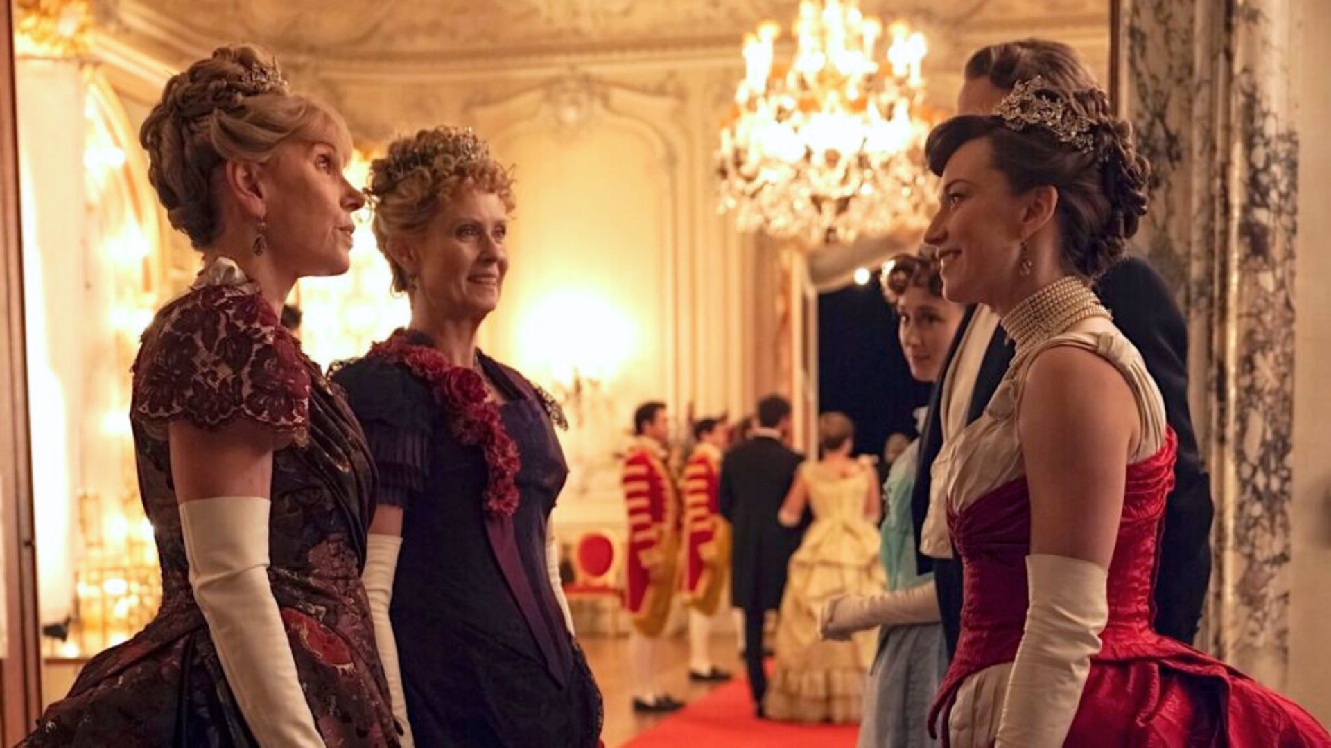Agnes and Ada talk to George and Bertha at a ball