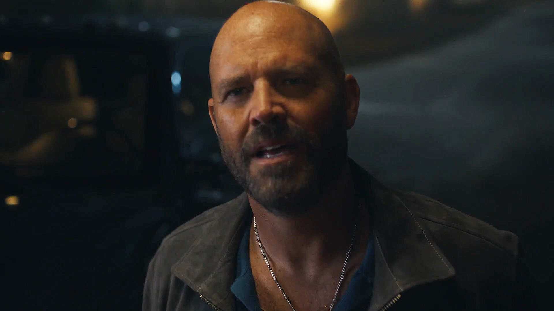 A close up of Keith Smith outside at night in Peacemaker season 2 episode 1