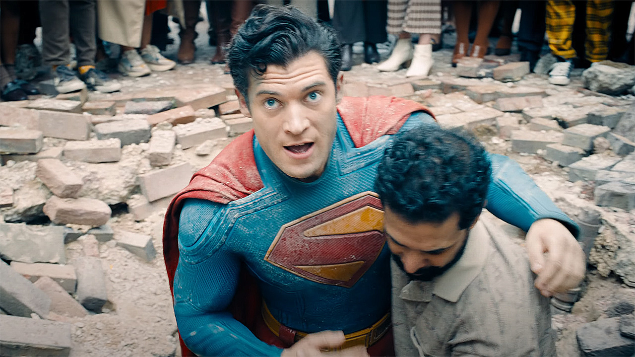 Superman being helped up by a pedestrian in 2025