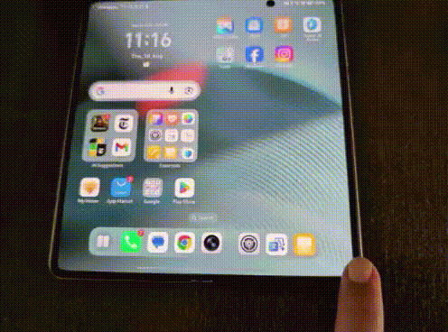 A photo showing Honor Magic V5 half unfolded with TechCrunch