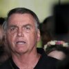 Former President Jair Bolsonaro speaks to the press after being formally charged by the federal police with attempted coup, at the airport in Brasilia, Brazil on Monday.