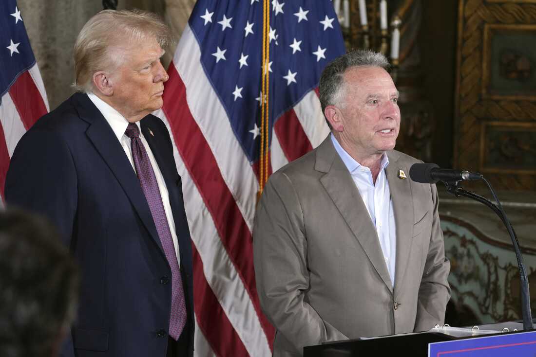 FILE - President-elect Donald Trump listens to Steve Witkoff speak during a news conference at Mar-a-Lago, Jan. 7, 2025, in Palm Beach, Fla.