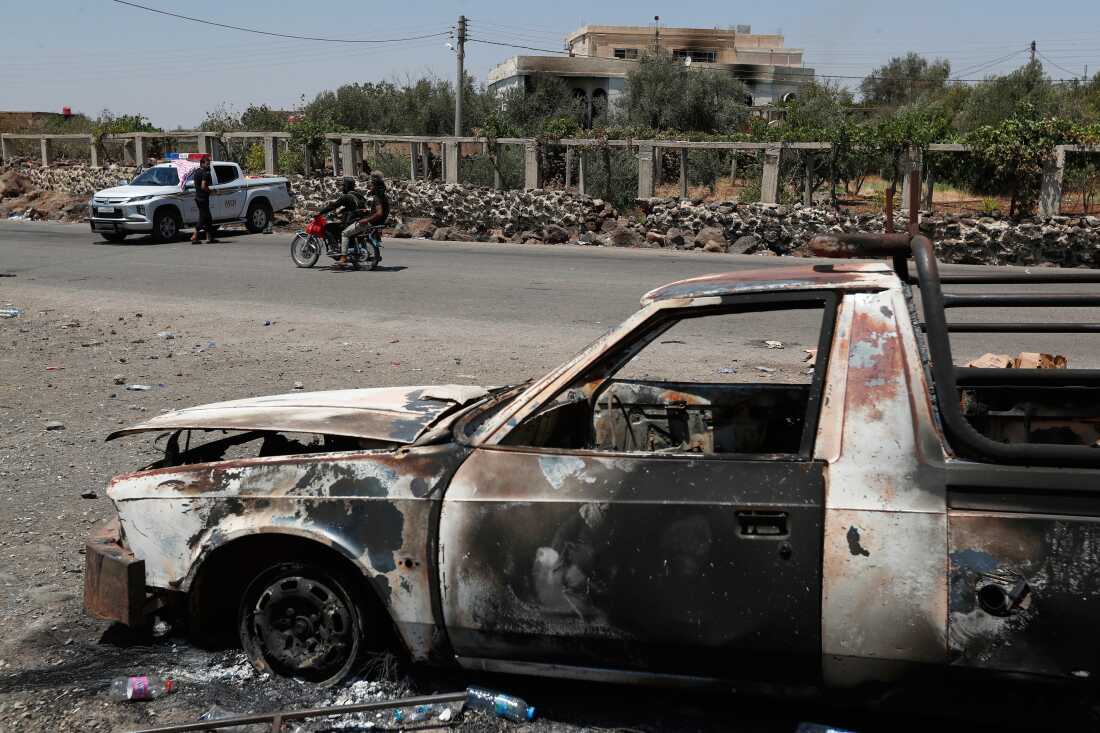 A Syrian security checkpoint is seen as forces deploy in Mazraa village on the outskirts of Sweida city, in southern Syria.