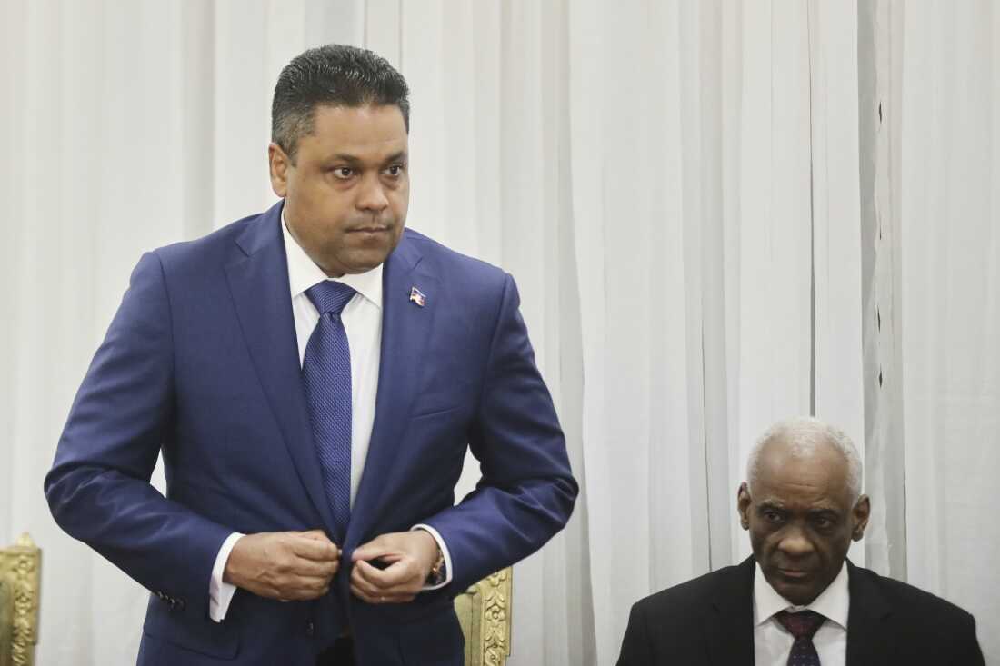 Laurent Saint-Cyr (left) attends the ceremony for his appointment as president of the Transitional Council in Port-au-Prince, Haiti, Thursday.