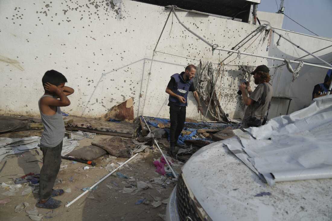 Palestinians inspect on Monday, Aug. 11, 2025, the destroyed tent where journalists, including Al Jazeera correspondents Anas al-Sharif and Mohamed Qureiqa were killed by an Israeli airstrike outside the Gaza City