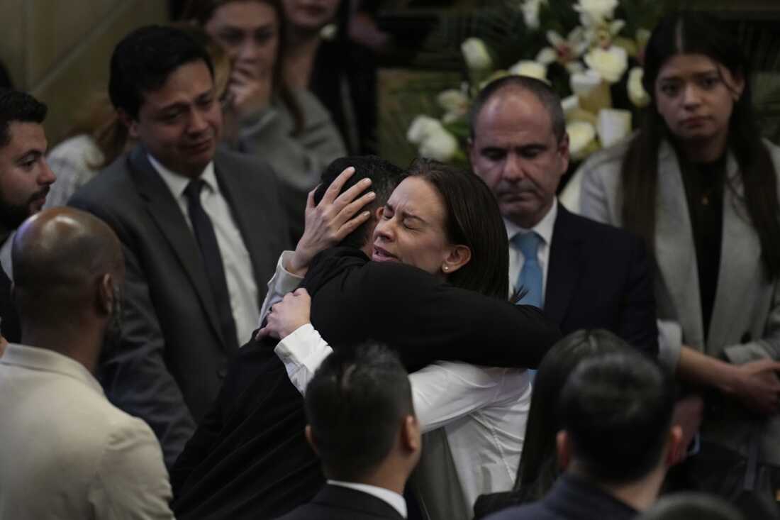 Claudia Tarazona, the wife of opposition Sen. and presidential hopeful Miguel Uribe, who died from wounds suffered when he was shot during a political rally, attends a ceremony honoring her husband, at Congress in Bogota, Colombia on Monday.