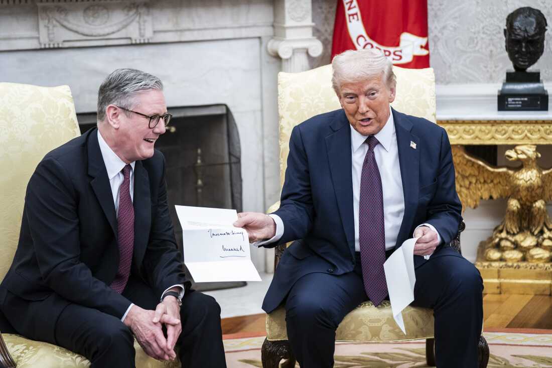 President Trump is given a letter from King Charles III, by British Prime Minister Keir Starmer in the Oval Office at the White House on Feb 27