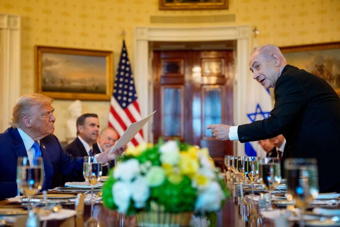 Israeli Prime Minister Benjamin Netanyahu hands a letter he sent to the Nobel Peace Prize committee to nominate President Trump for the Nobel Peace Prize on July 7 in Washington, D.C. Trump had been hosting Netanyahu to discuss a potential ceasefire agreement to end the fighting in Gaza.