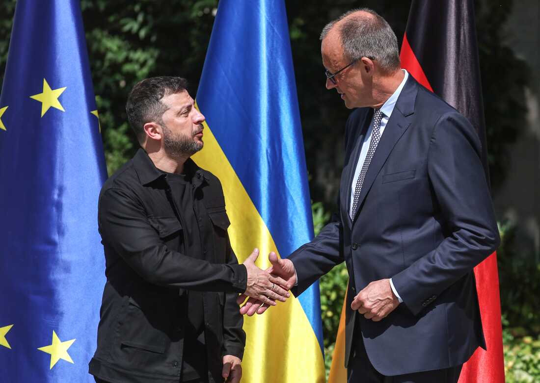 German Chancellor Friedrich Merz (R) welcomes Ukrainian President Volodymyr Zelensky in front of Chancellery ahead of a virtual meeting between European leaders, Ukrainian President Volodymyr Zelensky and U.S. President Donald Trump on August 13, 2025 in Berlin, Germany.