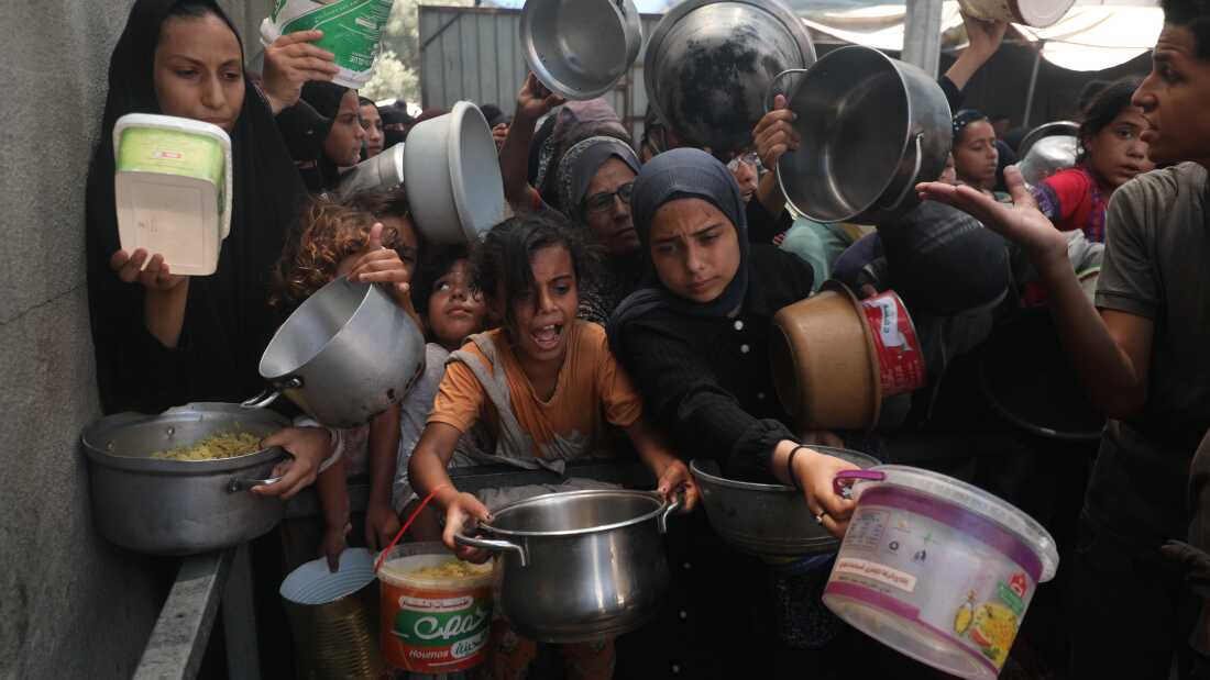 Palestinians, including children, who are struggling to access food due to Israel
