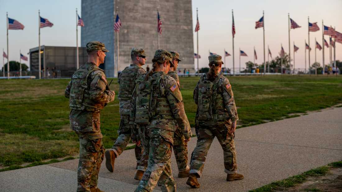 Members of the National Guard patrol near the Washington Monument on Saturday.