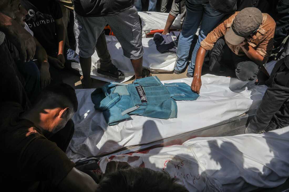 Palestinians mourn the death of journalists who were killed in an Israeli strike on Nasser Hospital in Khan Younis. Gaza