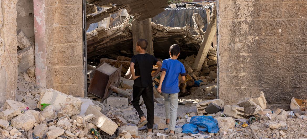 Children in the Jenin refugee camp in the West Bank looking at the destroyed shelters following recent military operations. (file)