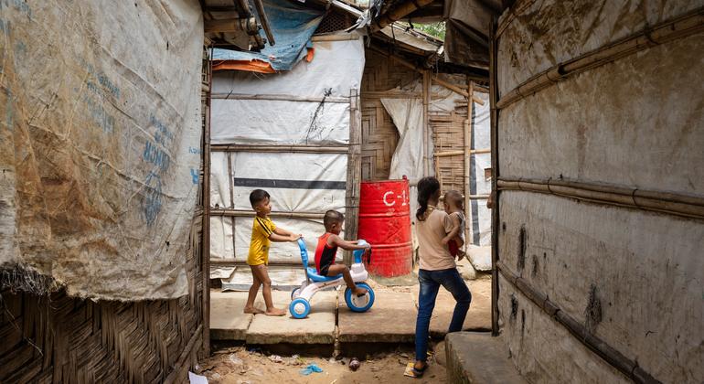Children walk between shelters in the Rohingya refugee camp in Cox’s Bazar, Bangladesh.