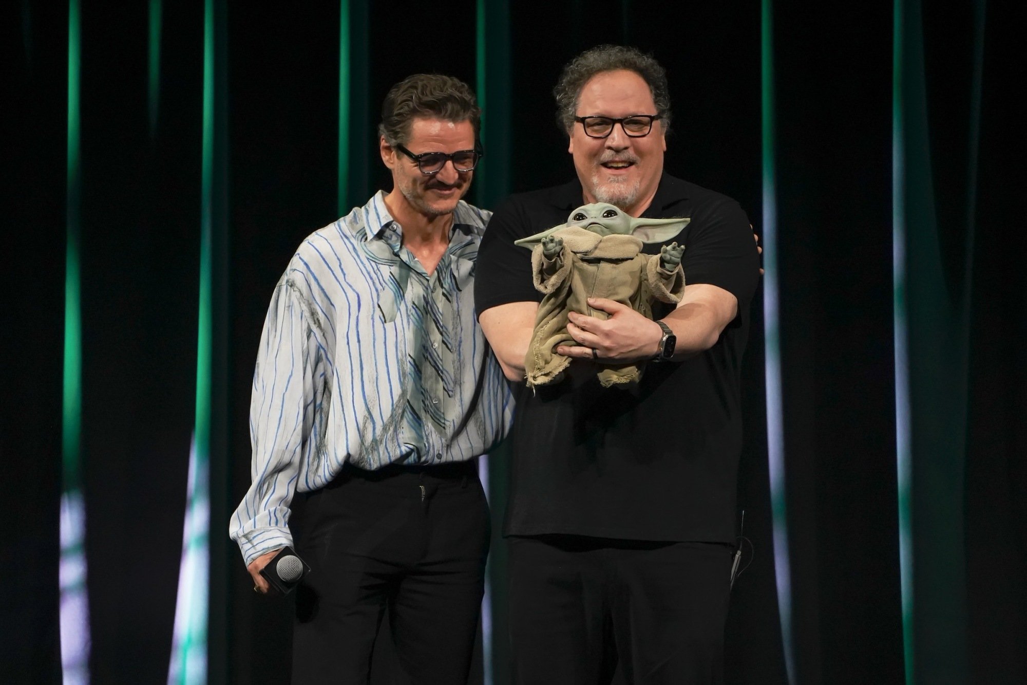 Pedro Pascal and Jon Favreau are seen on The Mandalorian & Grogu at Celebration Stage