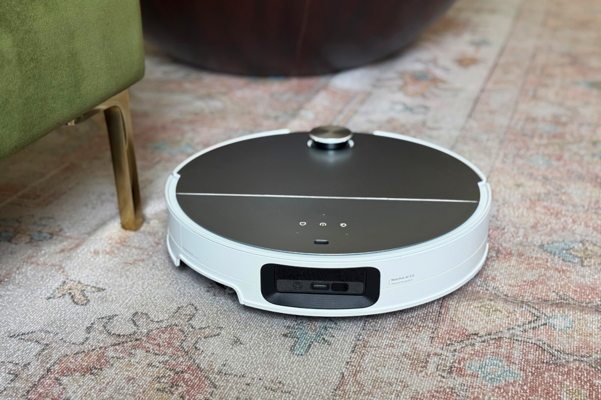Roborock Saros 10 robot vacuum with camera and sensors facing toward front