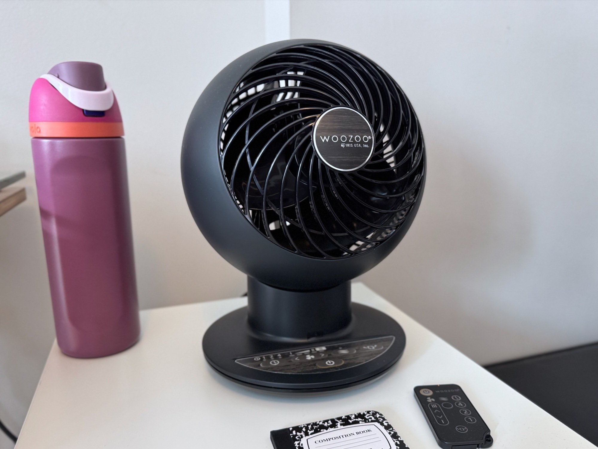 iris woozoo fan with water bottle and notepad