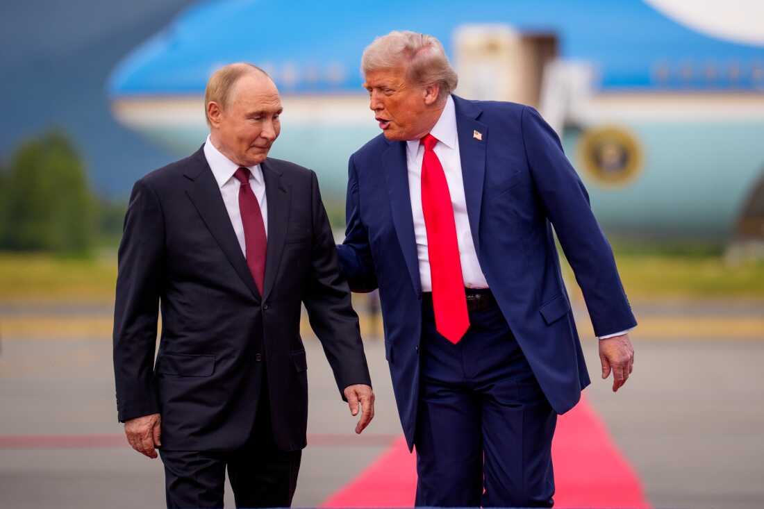 President Trump greets Russian President Vladimir Putin at Joint Base Elmendorf-Richardson on Friday in Anchorage, Alaska. On his flight to Alaska, Trump said his top priority was a ceasefire in the Russia-Ukraine war. After meeting with Putin, Trump said a ceasefire was not essential, and it was better to seek a permanent peace agreement.