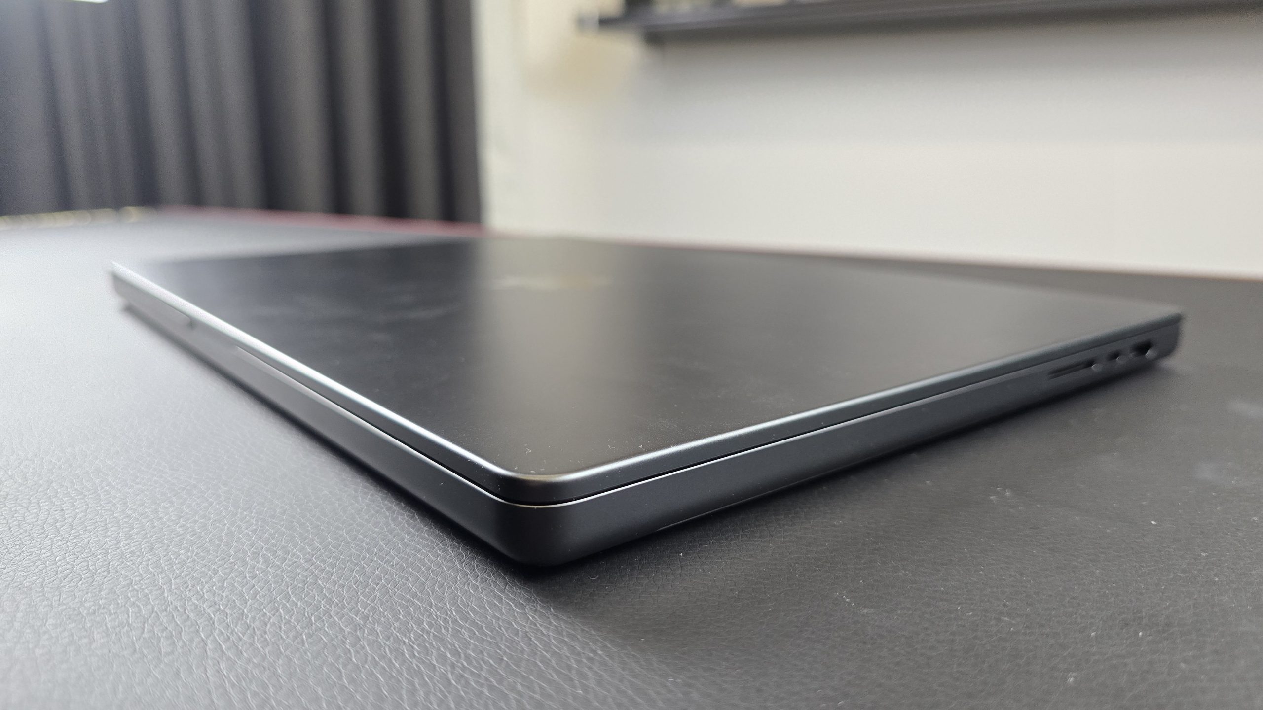 Closed 16-inch MacBook Pro with M4 Pro chip in a studio
