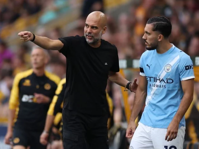 pep guardiola passes on instructions to rayan cherki before the substitute takes the field