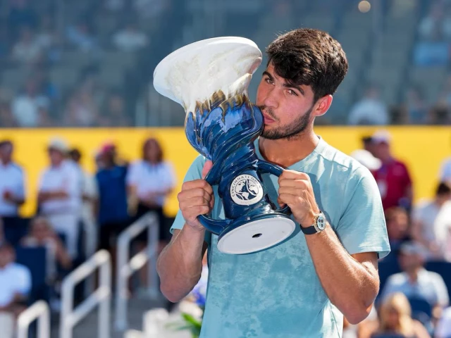 carlos alcaraz esp poses for a photo with the rookwood cup after his match against jannik sinner ita during the cincinnati open at the lindner family tennis center photo reuters