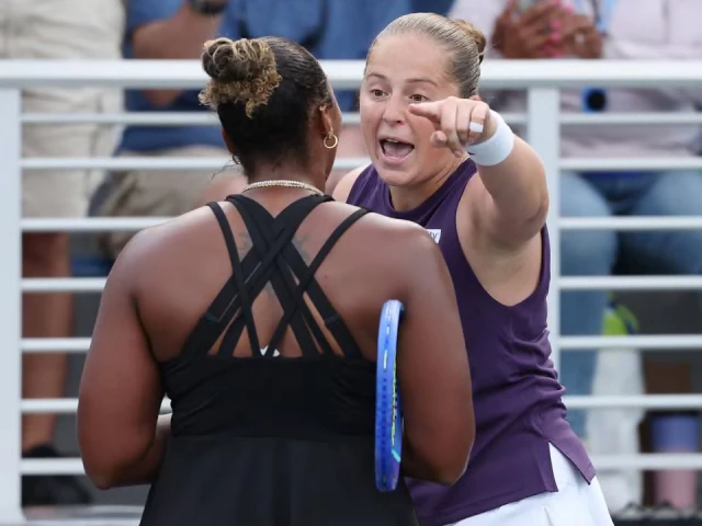 jelena ostapenko and taylor townsend exchange words at the net photo afp