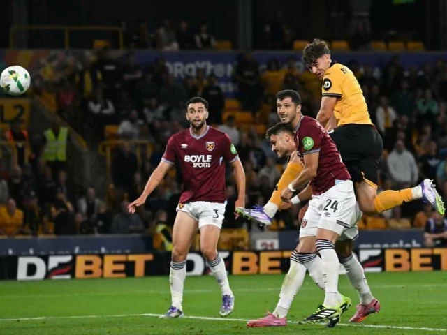 j rgen strand larsen rises above the west ham defence to score wolves third goal